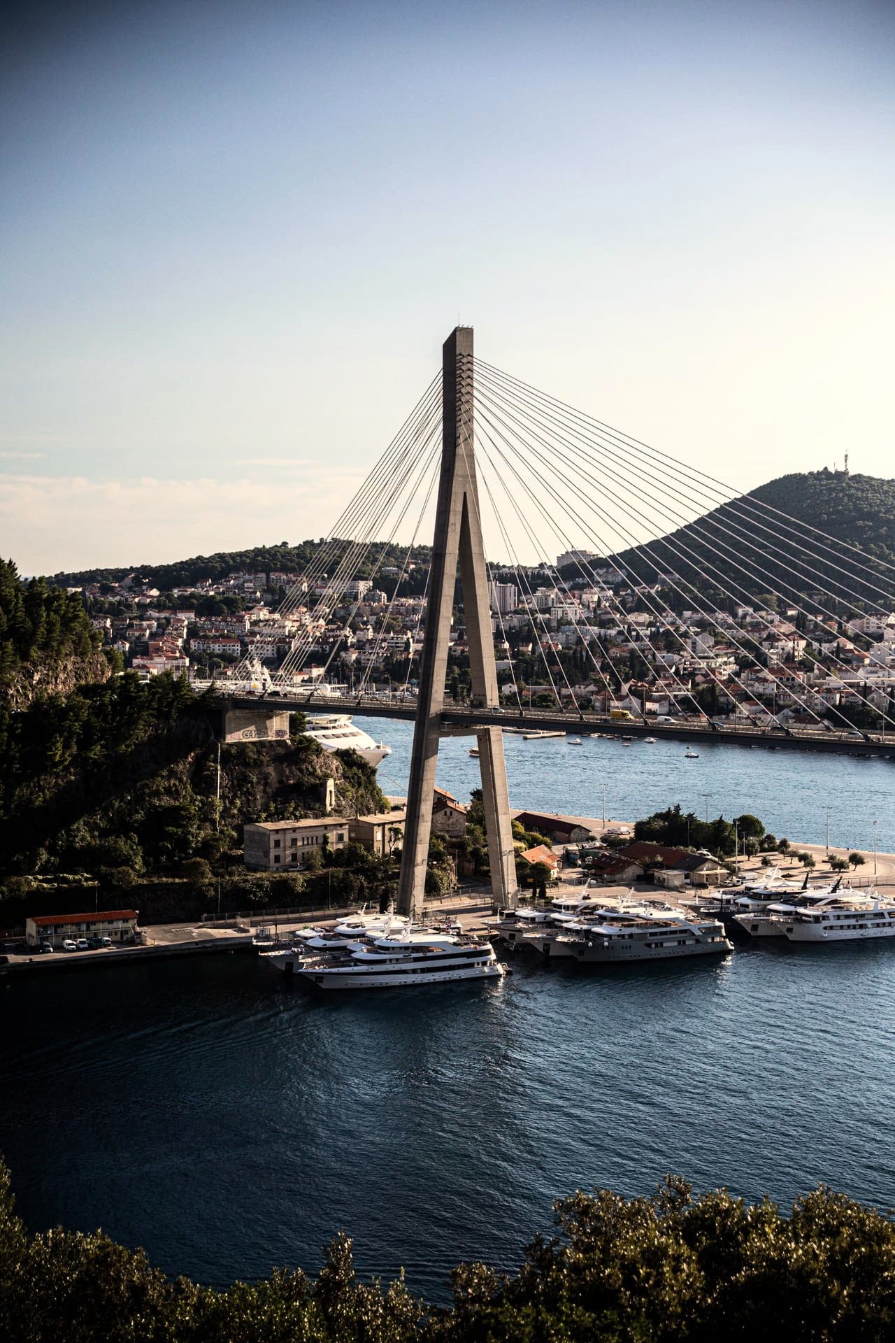 The Dubrovnik bridge over the bay, yachts in the marina below