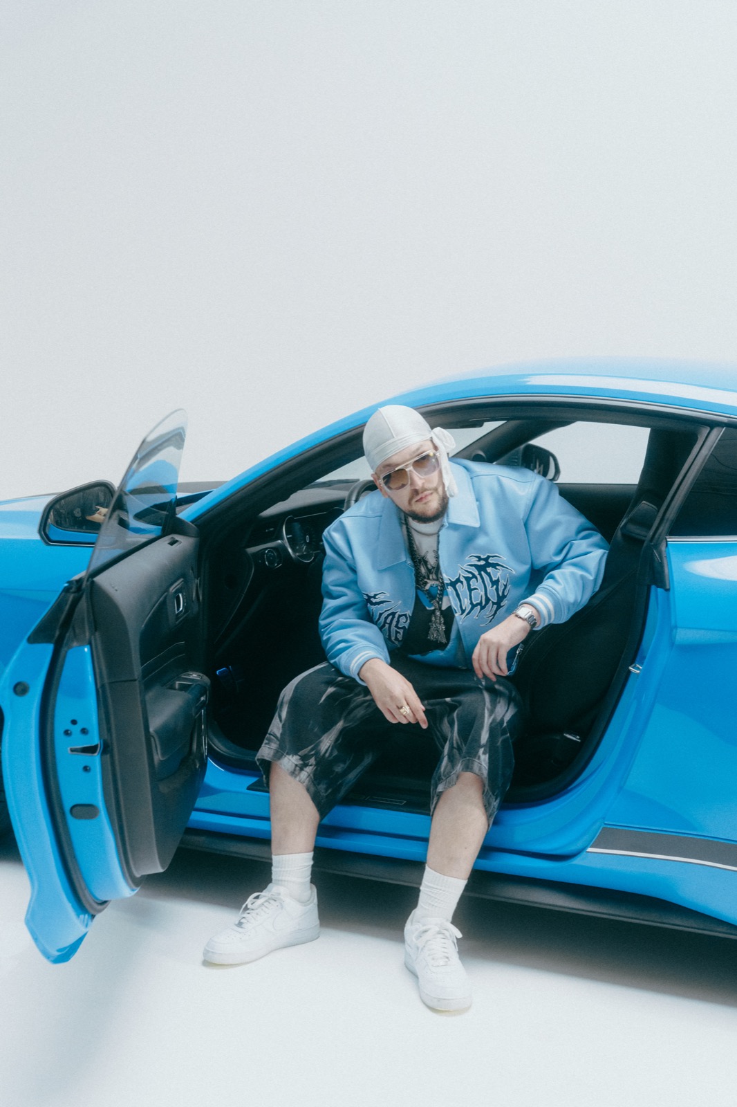 Hiljson Mandela — studio portrait with car